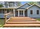 Backyard featuring a wood deck, a screened porch, and mature trees at 325 N Oakland Cir, Mcdonough, GA 30253