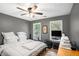 This bedroom provides two windows and plenty of room for a workspace at 325 N Oakland Cir, Mcdonough, GA 30253
