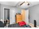 Bedroom featuring neutral walls, ceiling fan, closet and lots of natural light at 325 N Oakland Cir, Mcdonough, GA 30253