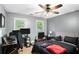 Bedroom with two windows and desk space, featuring two monitors at 325 N Oakland Cir, Mcdonough, GA 30253