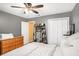 Bedroom with a ceiling fan, closet, and doorway to a yellow room at 325 N Oakland Cir, Mcdonough, GA 30253