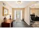 Warm and welcoming foyer with wood flooring and ample natural light at 325 N Oakland Cir, Mcdonough, GA 30253