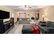 Open-concept living area with modern furnishings, a fireplace, and seamless flow to other rooms at 325 N Oakland Cir, Mcdonough, GA 30253