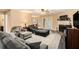 Comfortable living room with a fireplace, plush seating, and lots of natural light at 325 N Oakland Cir, Mcdonough, GA 30253