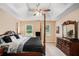The main bedroom offers two windows and a large chest of drawers at 325 N Oakland Cir, Mcdonough, GA 30253