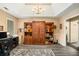 Home office featuring built-in shelving and tray ceiling at 325 N Oakland Cir, Mcdonough, GA 30253