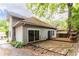 Back of the home featuring a sliding glass door and brick patio at 364 Brooks Ne Ave, Atlanta, GA 30307