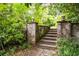 Backyard stone steps with detailed stone work, bordered by lush greenery at 364 Brooks Ne Ave, Atlanta, GA 30307