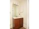 Half bath featuring a wood vanity, mirror and modern lighting at 364 Brooks Ne Ave, Atlanta, GA 30307
