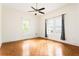 Bright bedroom featuring hardwood floors, two windows providing natural light, and ceiling fan at 364 Brooks Ne Ave, Atlanta, GA 30307