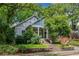 Inviting home exterior with lush landscaping and a classic design, nestled among mature trees at 364 Brooks Ne Ave, Atlanta, GA 30307