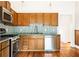 Kitchen features stainless appliances, granite countertops, hardwood floors, and tile backsplash at 364 Brooks Ne Ave, Atlanta, GA 30307