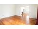 Bright living room featuring gleaming hardwood floors and a classic fireplace at 364 Brooks Ne Ave, Atlanta, GA 30307