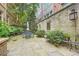 Stone-paved patio featuring lovely plants and outdoor dining furniture, perfect for entertaining at 2440 Peachtree Nw Rd # 9, Atlanta, GA 30305