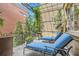 Relaxing balcony featuring brick walls, lounge chairs, with green foliage providing a private and comfortable retreat at 2440 Peachtree Nw Rd # 9, Atlanta, GA 30305