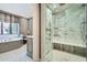 Modern bathroom with a spacious marble shower, elegant fixtures, and a stylish vanity area with a soaking tub at 2440 Peachtree Nw Rd # 9, Atlanta, GA 30305