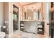 Bathroom featuring a gray vanity with a marble countertop, a large mirror, and a glass-enclosed shower at 2440 Peachtree Nw Rd # 9, Atlanta, GA 30305