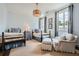 Bright and spacious bedroom featuring two beds, large windows, and a sitting area at 2440 Peachtree Nw Rd # 9, Atlanta, GA 30305