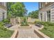 Secluded courtyard with fountain, benches, and lush greenery, providing a tranquil outdoor space at 2440 Peachtree Nw Rd # 9, Atlanta, GA 30305