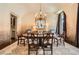 Formal dining room with chandelier, painting, large window, and seating for six at 2440 Peachtree Nw Rd # 9, Atlanta, GA 30305
