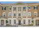 Elegant multi-story townhome with detailed architectural features and manicured landscaping at 2440 Peachtree Nw Rd # 9, Atlanta, GA 30305