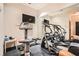 Well-equipped home gym with treadmill, elliptical, and mirrored wall at 2440 Peachtree Nw Rd # 9, Atlanta, GA 30305