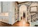 Hallway featuring hardwood floors, decorative brick and arched doorway at 2440 Peachtree Nw Rd # 9, Atlanta, GA 30305