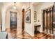 Grand hallway with hardwood floors, elevator and arched doorways at 2440 Peachtree Nw Rd # 9, Atlanta, GA 30305