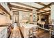 A chef's kitchen overlooks an adjacent living room, which is bathed in natural light at 2440 Peachtree Nw Rd # 9, Atlanta, GA 30305