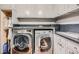 Efficient laundry room with modern appliances, built-in cabinets, and ample counter space for folding at 2440 Peachtree Nw Rd # 9, Atlanta, GA 30305