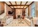Spacious living room with exposed brick, beam ceiling, and two sofas at 2440 Peachtree Nw Rd # 9, Atlanta, GA 30305