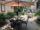 Charming patio with stone pavers, table and chairs, and lush landscaping, perfect for outdoor entertaining at 2440 Peachtree Nw Rd # 9, Atlanta, GA 30305