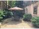 Charming patio with stone pavers, table and chairs, and lush landscaping, perfect for outdoor entertaining at 2440 Peachtree Nw Rd # 9, Atlanta, GA 30305