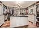 Spacious walk-in closet with custom shelving, ample storage, hardwood floors, and a central island at 2440 Peachtree Nw Rd # 9, Atlanta, GA 30305