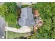 Aerial view of the property featuring a large backyard with a deck, patio, and well-manicured landscaping at 3004 High Vista Walk, Woodstock, GA 30189
