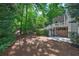 Lush backyard with a spacious patio, a multi-tiered deck, and plenty of room for outdoor enjoyment at 3004 High Vista Walk, Woodstock, GA 30189