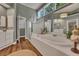 This bathroom features a separate shower, large tub, wood-look flooring, and large mirror at 3004 High Vista Walk, Woodstock, GA 30189