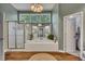 This bathroom boasts a separate shower, large tub, wood-look flooring, and a spacious layout at 3004 High Vista Walk, Woodstock, GA 30189