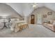 This bedroom features soft carpet, an vaulted ceiling, with abundant natural light at 3004 High Vista Walk, Woodstock, GA 30189