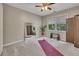 This bedroom features soft carpet, natural light, a large mirror, and versatile layout at 3004 High Vista Walk, Woodstock, GA 30189
