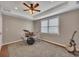 Finished bonus room features carpet flooring, a window with blinds, a ceiling fan, and closet at 3004 High Vista Walk, Woodstock, GA 30189