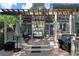 The deck has an outdoor seating area with a pergola above and stairs leading up to it at 3004 High Vista Walk, Woodstock, GA 30189