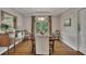 Elegant dining room with tray ceiling, chandelier, and wood flooring at 3004 High Vista Walk, Woodstock, GA 30189