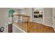 Bright foyer featuring hardwood floors, staircase and view of a bedroom with neutral color palette at 3004 High Vista Walk, Woodstock, GA 30189