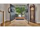 Grand foyer with open double doors leading to a brick porch and verdant views at 3004 High Vista Walk, Woodstock, GA 30189