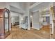 Spacious foyer showcasing hardwood floors, staircase, and open access to other rooms at 3004 High Vista Walk, Woodstock, GA 30189