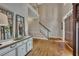 Elegant foyer with hardwood floors, staircase, and stylish console table at 3004 High Vista Walk, Woodstock, GA 30189
