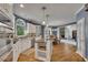 Spacious kitchen featuring white cabinets, an island, and hardwood flooring at 3004 High Vista Walk, Woodstock, GA 30189