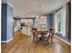Spacious kitchen with a large island, hardwood floors, and modern appliances at 3004 High Vista Walk, Woodstock, GA 30189