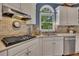 Well-equipped kitchen with granite counters, tile backsplash, and gas cooktop at 3004 High Vista Walk, Woodstock, GA 30189